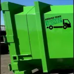Bright green dumpster with "Around Town Dumpster Rental" logo and truck graphic on the side.